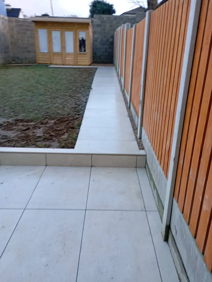 Porcelain path along a timber fence