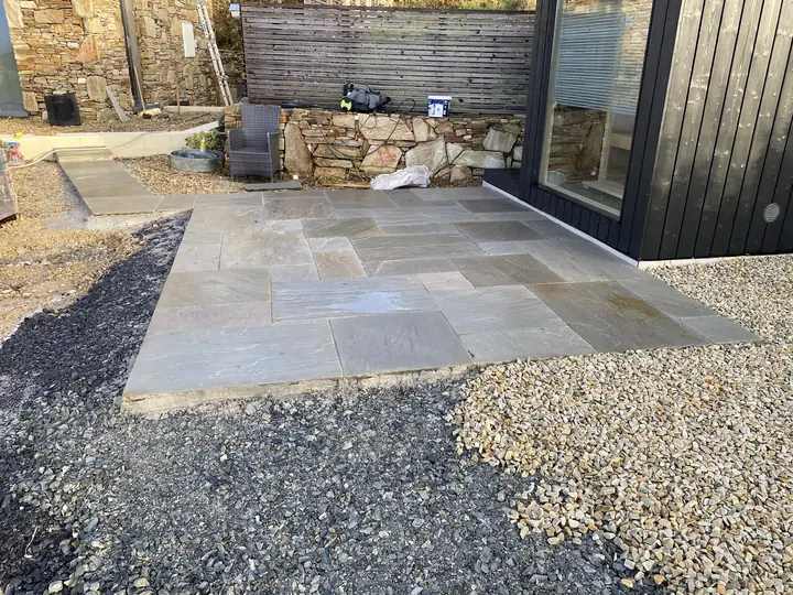 Stone patio with gravel borders