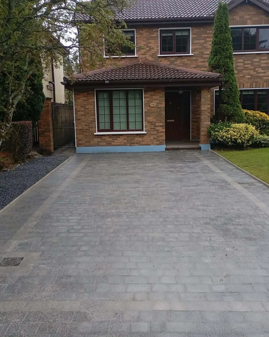 Finished charcoal block-paved driveway with a lighter border