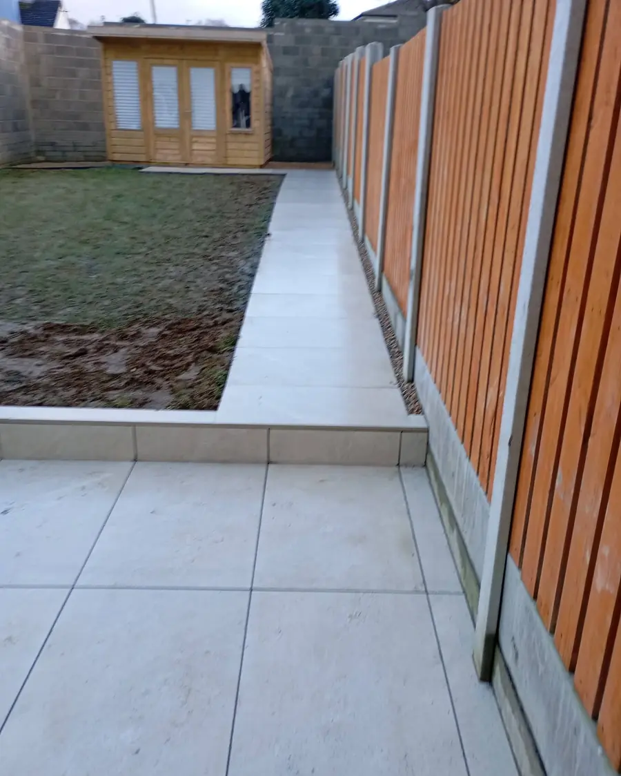 Porcelain path along a timber fence